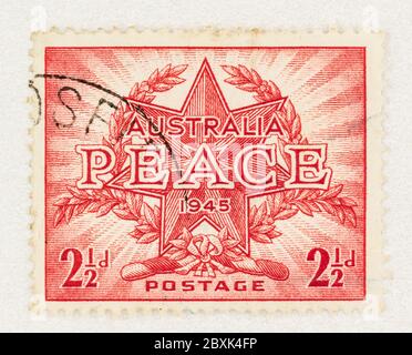 SEATTLE WASHINGTON - June 1, 2020:  Australian stamp commemorating the end of WW II in 1945, with official creast featuring wreath with star and Peace Stock Photo