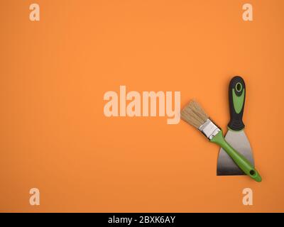 Green brush and spatula on an orange background. Stock Photo