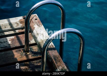 Limassol Cyprus June 07, 2020 View of the renovated wooden pier extensions allowing people to walk over the sea on Limassol promenade in the afternoon Stock Photo