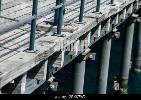 Limassol Cyprus June 07, 2020 View of the renovated wooden pier extensions allowing people to walk over the sea on Limassol promenade in the afternoon Stock Photo