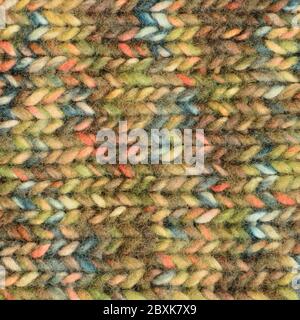 Warm green beige blue pink knitted wool melange blend handmade garment background, large detailed horizontal colorful textured woolen knitwear pattern Stock Photo