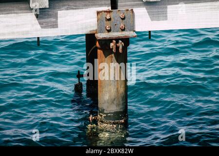 Limassol Cyprus June 07, 2020 View of the renovated wooden pier extensions allowing people to walk over the sea on Limassol promenade in the afternoon Stock Photo