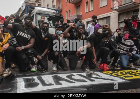 Milan, Italy. 07th June, 2020. African youths pose for a photo after the demonstration. Under a heavy rain, people gathered in Milano in solidarity with the Black Lives Matter march following the killing of George Floyd, a black man who died in police custody in Minneapolis. The event was organized by: Abba Vive, Black Diaspora Art, Festival DiversCity, Todo Cambia, Razzismo Brutta Storia, Afro Fashion Week Milano and had seen the participation of many civil associations. Credit: SOPA Images Limited/Alamy Live News Stock Photo