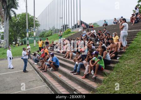 Members of 'Jesús Pescador de Hombres' foundation giving food aid to stranded Venezuelans in Cali. The organisation prepares and distributes hundreds Stock Photo