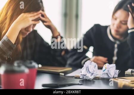 Businesspeople get stressed while having a problem in business meeting Stock Photo