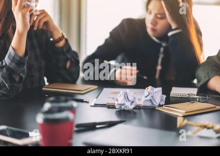 Businesspeople get stressed while having a problem in business meeting Stock Photo
