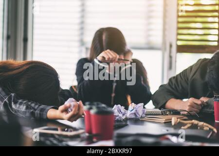 Businesspeople get stressed while having a problem in business meeting Stock Photo