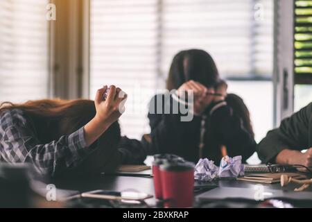 Businesspeople get stressed while having a problem in business meeting Stock Photo