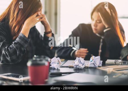 Businesspeople get stressed while having a problem in business meeting Stock Photo