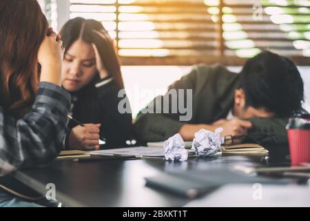 Businesspeople get stressed while having a problem in business meeting Stock Photo