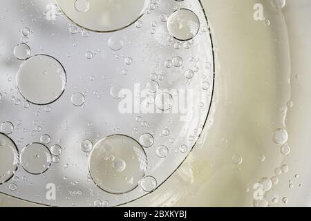 Bubbles and circles on an abstract liquid texture background Stock Photo