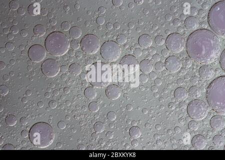 Bubbles and circles on an abstract liquid texture background Stock Photo