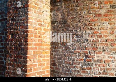 Old, weathered bricks in wall Stock Photo