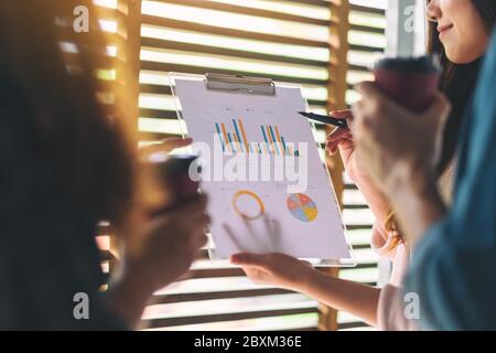 Group of businessman working and discussing about business data together in office Stock Photo
