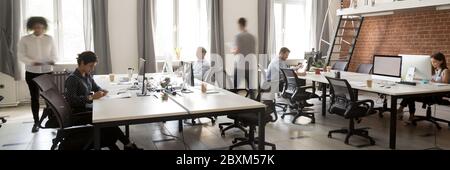 Group of multiethnic employees working in co-working open space Stock Photo