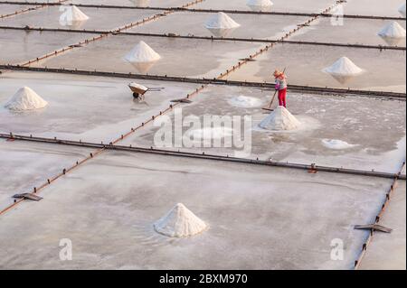 salt farmer in the Salt pans at Tainan, Taiwan Stock Photo