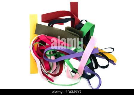 Multi-colored strips of felt fabric on white background. A kind of felt, non-woven material. Top view. Stock Photo