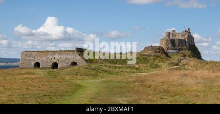 Historic lime kilns and castle on Lindisfarne - Holy Island - Northumberland Stock Photo