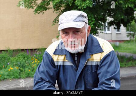 Portrait of an intelligent bearded man in a cap Stock Photo
