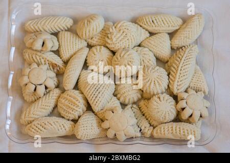 Traditional arabic holiday semolina sweets, "maamoul", filled with dates. Stock Photo