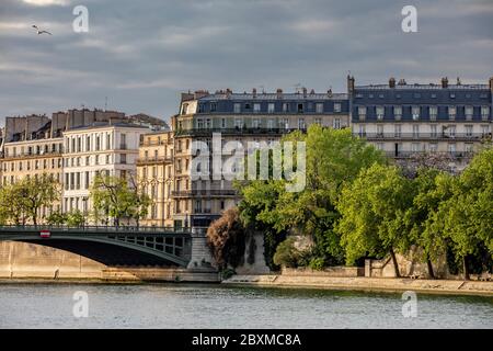 Paris, France - April 25, 2020: Typical Haussmann buildings along the Seine river Stock Photo