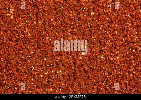 Saturated brick-colour, orange background with glitter. Stock Photo