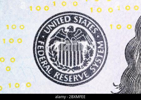 Macro shot of United States Federal Reserve System sign on new 100 dollar bill. Stock Photo