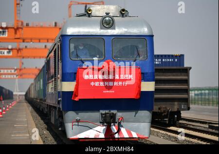 (200608) -- BEIJING, June 8, 2020 (Xinhua) -- China-Europe freight train X9202 loaded with cars, accessories, food and clothes bound for Ulan Bator of Mongolia prepares to leave a railway station in north China's Tianjin Municipality, May 20, 2020. Initiated in 2011, the China-Europe rail transport service is considered a significant part of the Belt and Road Initiative to boost trade between China and countries participating in the program. Amid the coronavirus pandemic, the service remained a reliable transportation channel as air, sea and road transportation have been severely affected. T Stock Photo