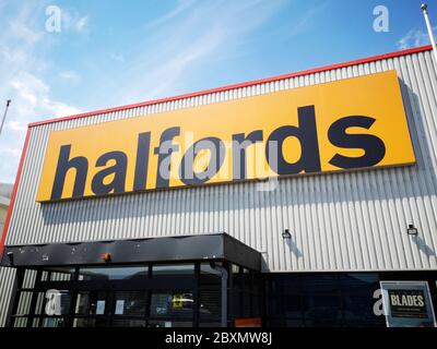 Cardiff, UK: June 02, 2020: Halfords shop front. Halfords Group plc is a British retailer of car parts, car enhancement, camping, touring and bicycles Stock Photo