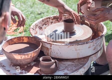 DIY concept. Ceramic handmade decorative glazed dish.Process in workshop. Hands with clay.. Stock Photo