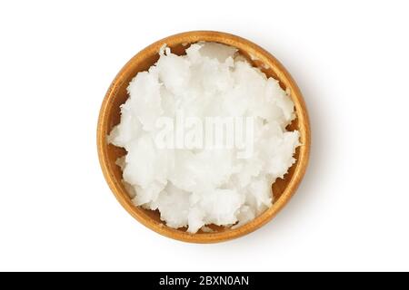 Coconut oil in wooden bowl on white background Stock Photo