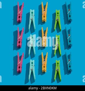 Clothes pins as pattern on blue background Stock Photo