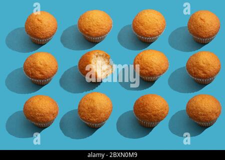 Set of different muffins pattern on blue background Stock Photo