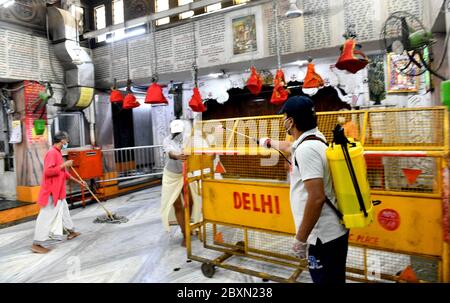 (200608) -- NEW DELHI, June 8, 2020 (Xinhua) -- Staff members disinfect the Lord Hanuman Temple to prepare it for reopening at Cannaught Place in New Delhi, India, June 6, 2020. People thronged into places of worship like temples, mosques, churches, and gurudwaras (for Sikh community) in India on Monday as religious places reopened across many states after 76 days of lockdown due to COVID-19. The reopening of religious places was permitted by fresh guidelines issued by the federal government on June 4, which stated 'Religious places or places of worship for public in containment zones shal Stock Photo