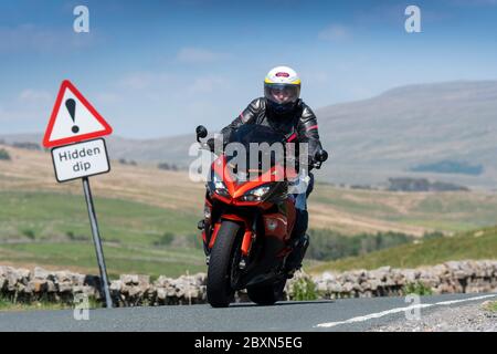 Motorcyclists driving up the B6255 Widdale road between Hawes and