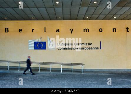 Blurred man walking in front of The European Commission Stock Photo