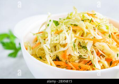 Fresh coleslaw salad in white bowl. Stock Photo