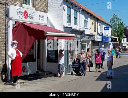 Customers queueing - social distancing - at a butchers shop in Hessle, near Hull, Humberside, East Yorkshire, England UK Stock Photo