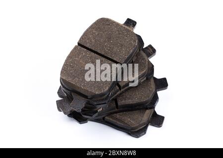 Set of old brake pads, car spares isolated on white background Stock Photo