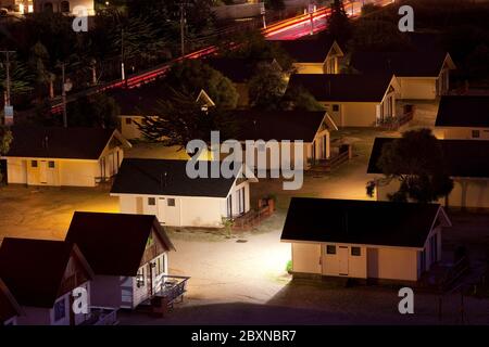 La Herradura Beach, Coquimbo, Coquimbo Region, Chile - Empty vacation cabins at night. Stock Photo