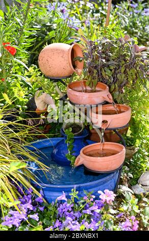 A solar powered small water feature in British garden bought from B&Q