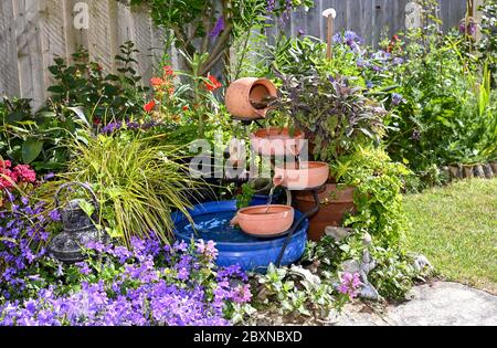 Solar powered garden water feature blue bowl by pot plants UK Stock