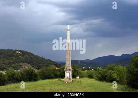 Single Obelisk Against Dramatic Stormy Sky in Grounds of Château de Valbelle Tourves Var Provence France Stock Photo