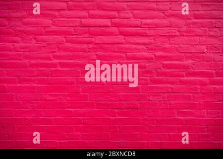 Saturated pink brickwall Background with cement texture Stock Photo