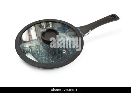 Photo of a ceramic frying pan and cover isolated on a white background. Studio shot Stock Photo
