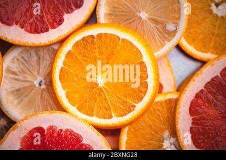 Sliced Oranges on the white wood background In the studio Stock Photo