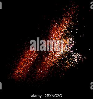 Glowing golden glitter scattered on a black background. Holidays creative composition. Stock Photo