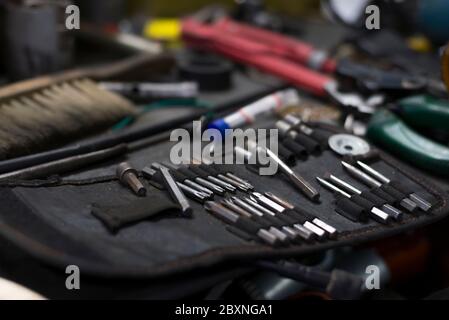 Big set of tools, wich lying on the desktop in garage Stock Photo