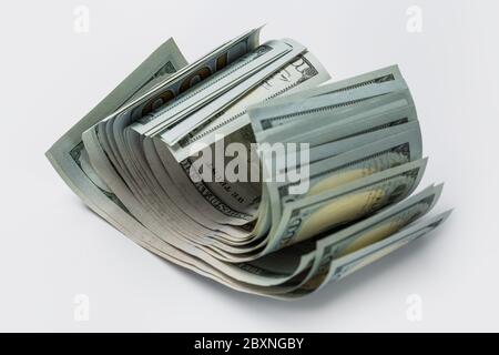 Stack of hundred crumpled dollars isolated on white Stock Photo