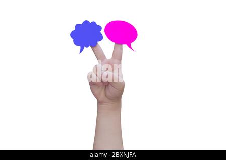 Two speech bubbles on child hand fingers isolated on white background, with clipping path. Stock Photo
